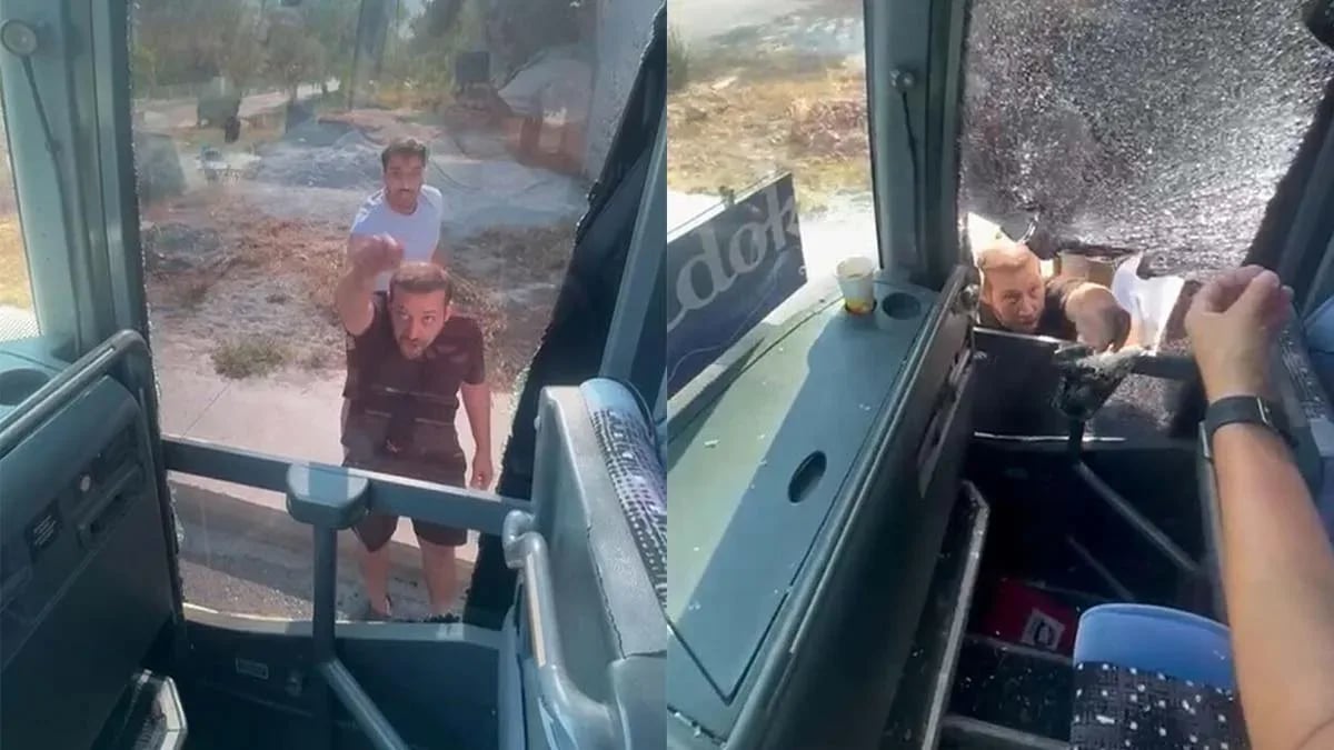 Turistleri taşıyan otobüsün önünü kesip, şoföre taşla saldırdılar
